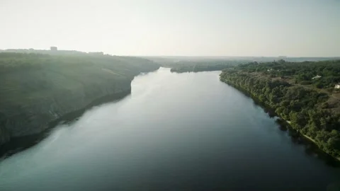 Aerial view of the wide river with two green shores 4K Video stock 204976706