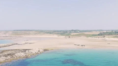 Aerial view of the wide sandy beach and turquoise waters of Anse du Croc in Stock Footage 346676977