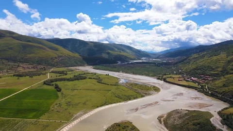 Aerial view of wide tidal flat winding river grassland in Aba Sichuan China Video stock 337926335