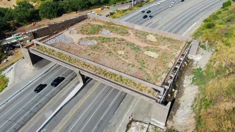 Aerial View Widescreen Pull Back Shot of Wallis Annenberg Wildlife Crossing Stock Footage 335551041