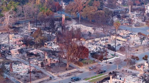 Aerial view of wildfire damage in Altadena neighborhood of Los Angeles Stock Footage 301647947