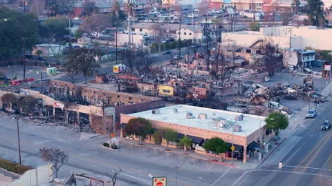 Aerial view of wildfire damage in Altadena neighborhood of Los Angeles Stock Footage 301649670