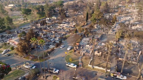 Aerial view of wildfire damage in Altadena neighborhood of Los Angeles Stock Footage 301653989