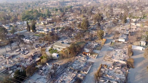 Aerial view of wildfire damage in Altadena neighborhood of Los Angeles Stock Footage 301654025