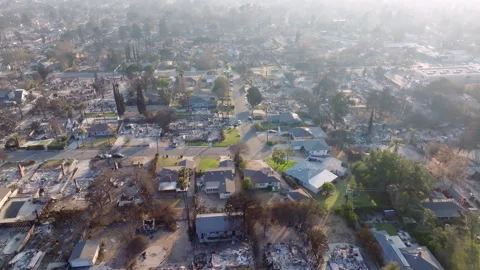 Aerial view of wildfire damage in Altadena neighborhood of Los Angeles Stock Footage 301660662