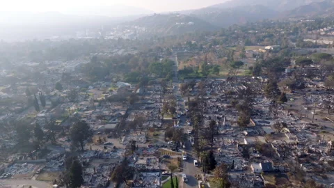 Aerial view of wildfire damage in Altadena neighborhood of Los Angeles Stock Footage 301662409