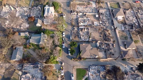 Aerial view of wildfire damage in Altadena neighborhood of Los Angeles Stock Footage 301664458