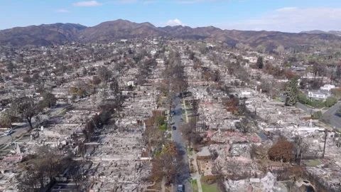 Aerial view of wildfire damage in Pacific Palisades neighborhood of Los Angeles Stock Footage 301580933