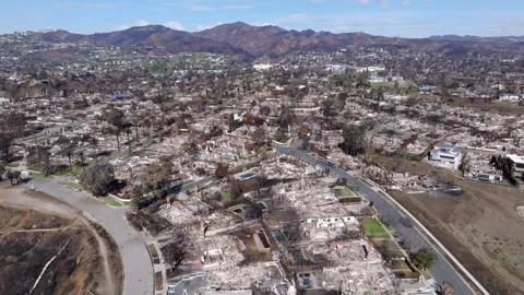 Aerial view of wildfire damage in Pacific Palisades neighborhood of Los Angeles Stock Footage 301582474