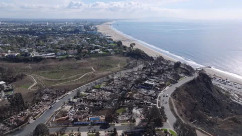 Aerial view of wildfire damage in Pacific Palisades neighborhood of Los Angeles Stock Footage 301582640