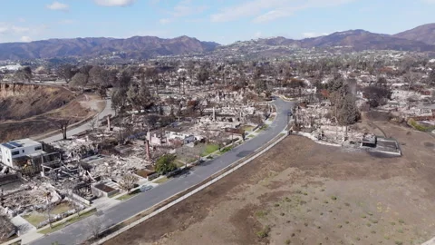 Aerial view of wildfire damage in Pacific Palisades neighborhood of Los Angeles Stock Footage 301584154