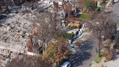 Aerial view of wildfire damage in Pacific Palisades neighborhood of Los Angeles Stock Footage 301584808