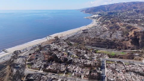 Aerial view of wildfire damage in Pacific Palisades neighborhood of Los Angeles Stock Footage 301588102