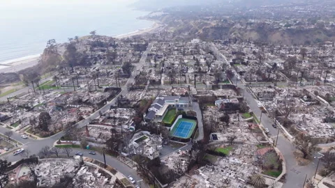 Aerial view of wildfire damage in Pacific Palisades, California Stock Footage 302386869