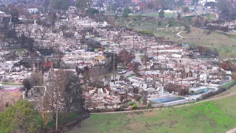 Aerial view of wildfire damage in Pacific Palisades, California Stock Footage 302387097
