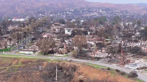 Aerial view of wildfire damage in Pacific Palisades, California Stock Footage 302387611