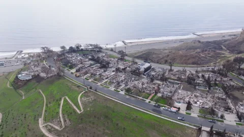 Aerial view of wildfire damage in Pacific Palisades, California Stock Footage 302387791