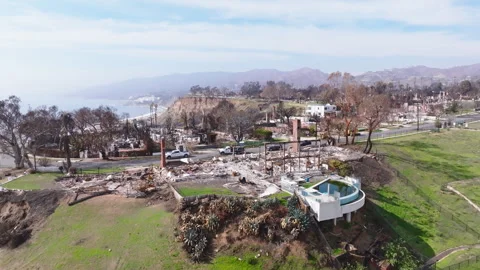 Aerial view of wildfire damage in Pacific Palisades, California Stock Footage 302388609