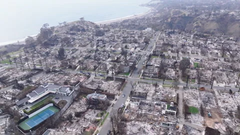 Aerial view of wildfire damage in Pacific Palisades, California Stock Footage 302388754