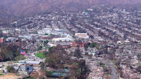 Aerial view of wildfire damage in Pacific Palisades, California Stock Footage 302390138