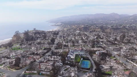 Aerial view of wildfire damage in Pacific Palisades, California Stock Footage 302390176