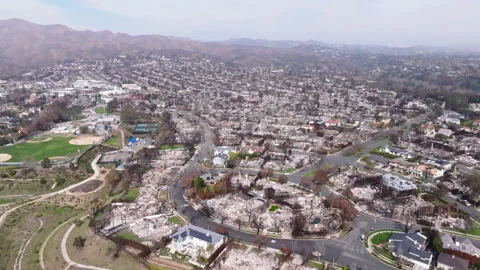 Aerial view of wildfire damage in Pacific Palisades, California Stock Footage 302390267