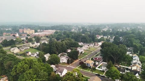 Aerial view of wildfire smoke drifting over a residential neighborhood... Видео 340291056