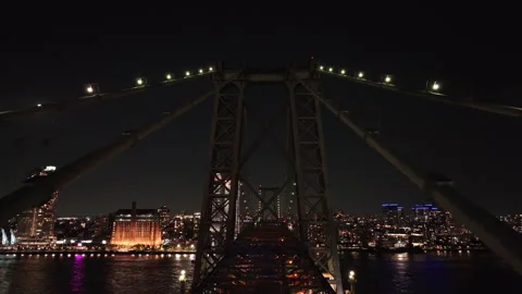 Aerial view of The Williamsburg Bridge against the night sky Stock Footage 252125671