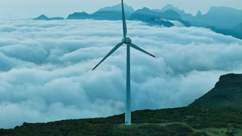 Aerial view of wind energy infrastructure in mountain terrain Stock Footage 336304031