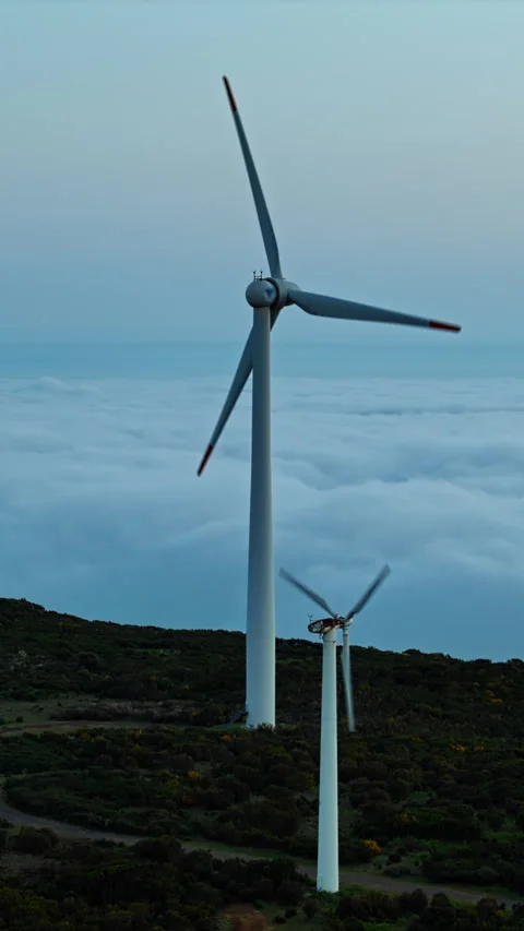 Aerial view of wind farm above clouds, energy transition Stock Footage 340078710