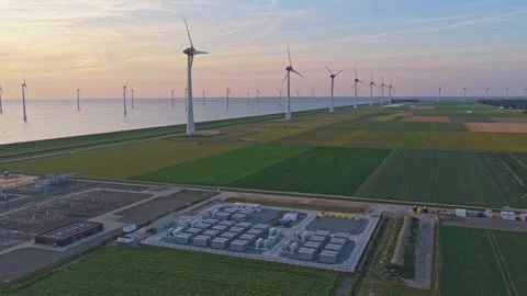 Aerial view of wind farm and battery energy storage system at sunset 動画素材 341875734
