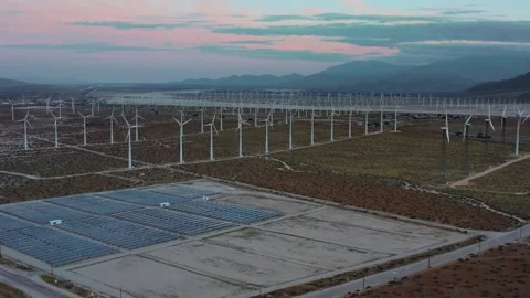Aerial View Of A Wind Farm Featuring Wind Turbines And Solar Panels Stock Footage 347746396