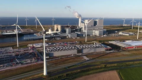 Aerial view of wind farm powering industrial data center Stock Footage 344768393