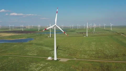 Aerial view of wind farm in vast green fields in Russia. Stock Footage 345583065