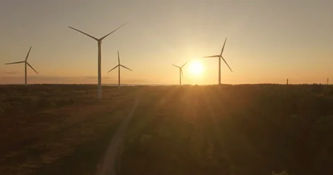 Aerial view of wind generators in the evening sky on the field. Video stock 87846769