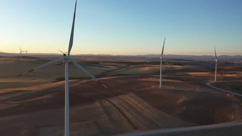 Aerial view of wind power plants in wide field 2 Stock Footage 294081789