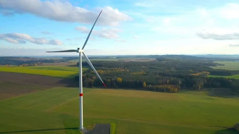 Aerial view to wind turbine. Camera flight around power plant. Stock Footage 120120822
