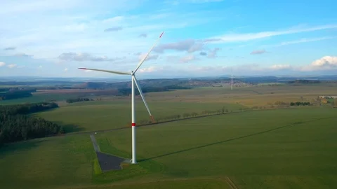 Aerial view to wind turbine. Camera flight around power plant. Stock Footage 120121376