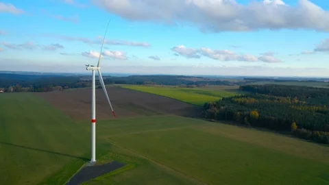 Aerial view to wind turbine. Camera flight around power plant. Stock Footage 120121519