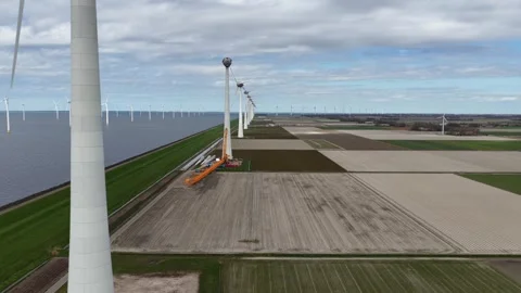 Aerial view of wind turbine construction and maintenance Stock-Footage 335625019