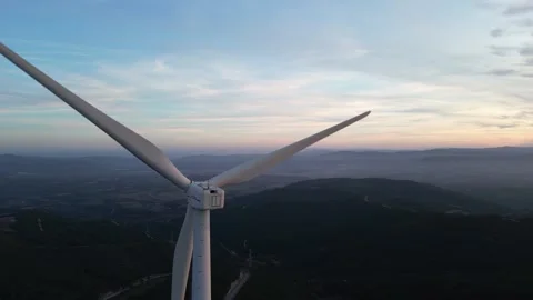 Aerial view of wind turbine generating renewable energy at sunset Stock Footage 331634406