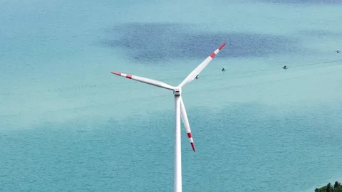 Aerial View of Wind Turbine Over a Turquoise Mountain Lake 2 shot Stock Footage 342187953
