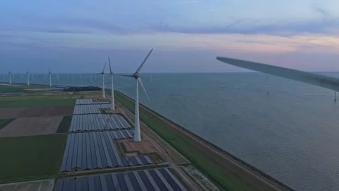 Aerial view of wind turbines and solar panels producing renewable energy Stock Footage 341876104