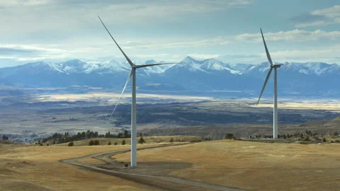 Aerial view of wind turbines with the Beartooth mountains in the background Stock Footage 266025341