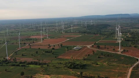 Aerial view of wind turbines on the field. Production of clean energy  Video stock 112400040
