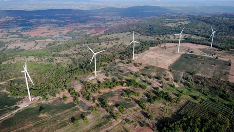 Aerial view of wind turbines on the fields Power generation using energy from cl Stock Footage 108962260