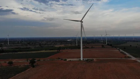 Aerial view of wind turbines on the fields Power generation using energy from cl Stock Footage 109166243