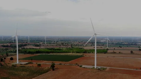 Aerial view of wind turbines on the fields Power generation using energy from cl Stock Footage 109166271