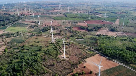 Aerial view of wind turbines on the fields Power generation using energy from cl Stock Footage 119426326