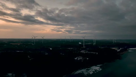 Aerial view of wind turbines generating clean energy at sunset Stock Footage 295912370